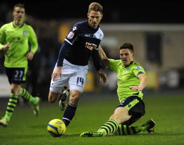 Framed Print : FA Cup Fourth Round Showdown: Henry vs. Clark's Intense Battle at The Den