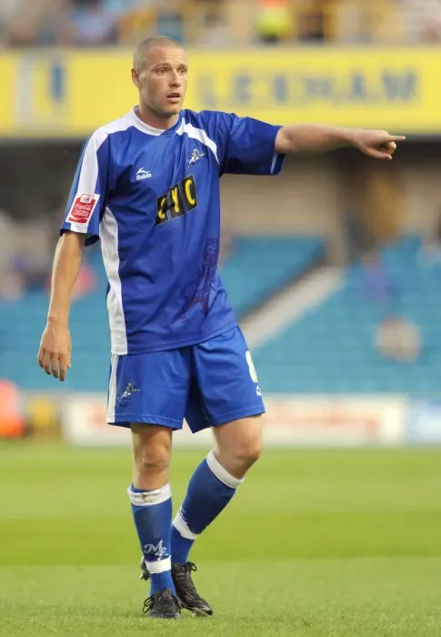 Framed Print : Gary Alexander's Thrilling Performance: Millwall vs Oldham Athletic in Football League One (18-08-2009)