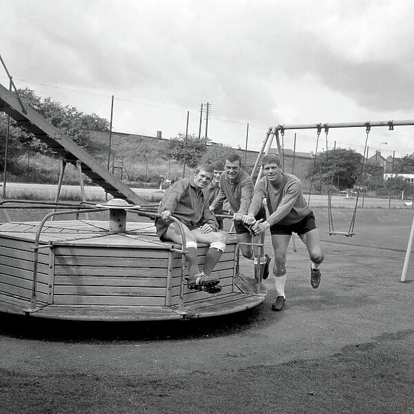 Millwall Football Club: Pre-Season Laughs - New Signing Derek Possee Rides a Roundabout with Team-Mates Lawrie Leslie, Keith Weller, and William Neil