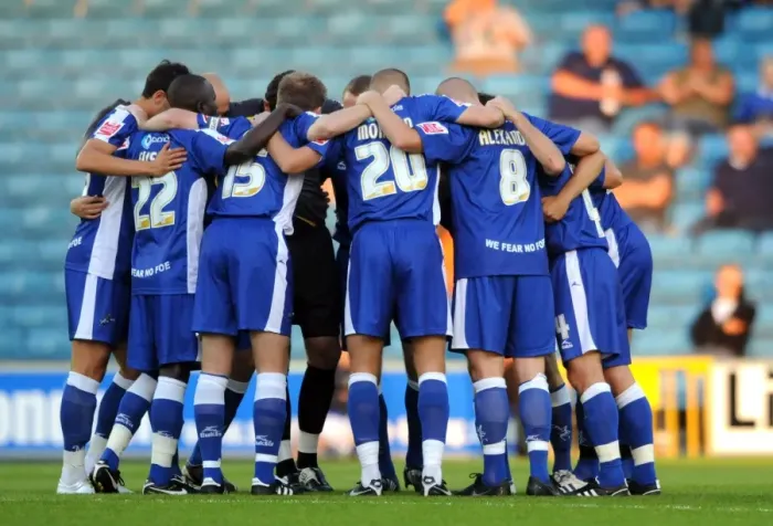 Framed Print : Millwall Players Unite in Huddle during Coca-Cola Football League One Match against Oldham Athletic at The New Den Framed Print : Millwall Players Unite in Huddle during Coca-Cola Football League One Match against Oldham Athletic at The New Den