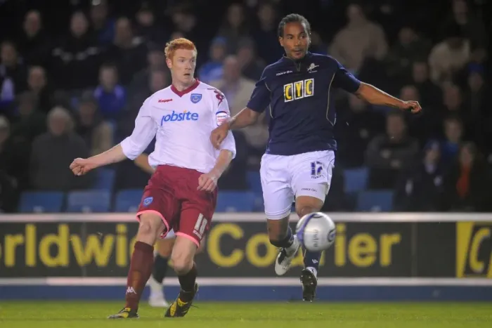 Framed Print : Millwall vs Portsmouth: A Championship Clash - Tamika Mkandawire vs Dave Kitson at The New Den (19-10-2010)