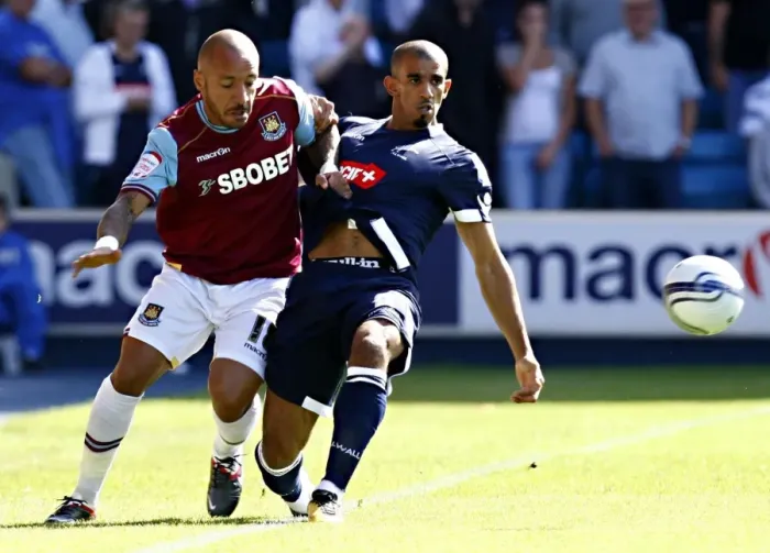 Framed Print : Millwall vs. West Ham United: A Championship Battle at The Den - Faubert vs. Bouazza