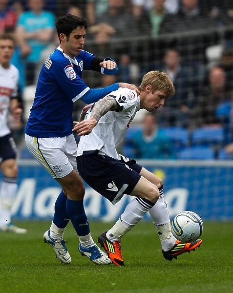 Millwall's Andy Keogh Holds Off Cardiff City's Peter Whittingham in Npower Championship Clash