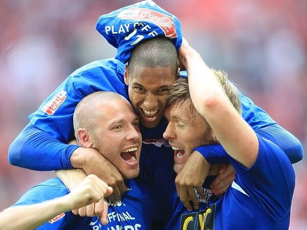 The Triumphant Threesome: Millwall's Alexander, Batt, and Ward Celebrate Promotion at Wembley