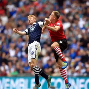 Barnsley vs Millwall - Intense Aerial Battle: Lee Gregory vs Marc Roberts - Sky Bet League One Play-Off Final at Wembley Stadium Barnsley vs Millwall - Intense Aerial Battle: Lee Gregory vs Marc Roberts - Sky Bet League One Play-Off Final at Wembley Stadium