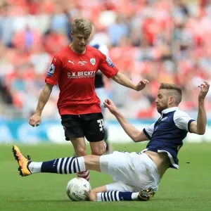 Barnsley's Lloyd Isgrove and Millwall's Mark Beevers Clash in League One Play-Off Final at Wembley Stadium Barnsley's Lloyd Isgrove and Millwall's Mark Beevers Clash in League One Play-Off Final at Wembley Stadium