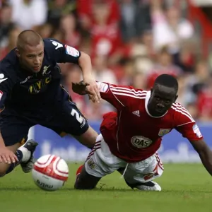 Battle for Supremacy: Dunne vs. Adomah in the Npower Championship Clash between Millwall and Bristol City (07-08-2010)