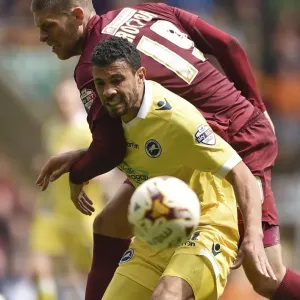 Bradford City vs. Millwall: Intense Battle for the Ball in the Sky Bet League One Play-Off First Leg Bradford City vs. Millwall: Intense Battle for the Ball in the Sky Bet League One Play-Off First Leg