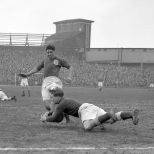 Intense Moment: Ken Chisholm Tackles Malcolm Finlayson in Millwall vs Leeds United Soccer Match Intense Moment: Ken Chisholm Tackles Malcolm Finlayson in Millwall vs Leeds United Soccer Match