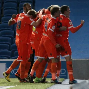 Millwall Celebrate First Goal Against Brighton and Hove Albion in Championship Match at AMEX Stadium