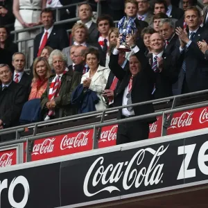 Millwall FC Celebrate Promotion to League One: Kenny Jackett and Team Lift the Play-Off Trophy at Wembley Stadium Millwall FC Celebrate Promotion to League One: Kenny Jackett and Team Lift the Play-Off Trophy at Wembley Stadium