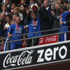 Millwall FC's John Sullivan Lifts the Promotion Trophy at Wembley Stadium Millwall FC's John Sullivan Lifts the Promotion Trophy at Wembley Stadium