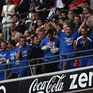 Millwall Football Club: Steve Morison Lifts the League One Play-Off Trophy at Wembley Stadium (The Triumphant Moment)