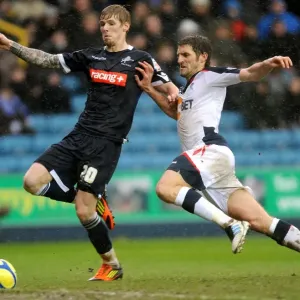 Millwall vs Bolton Wanderers: FA Cup Fifth Round Clash - Intense Battle Between Andrew Keogh and Samuel Ricketts Millwall vs Bolton Wanderers: FA Cup Fifth Round Clash - Intense Battle Between Andrew Keogh and Samuel Ricketts
