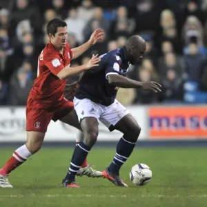 Millwall vs Charlton Athletic: Clash between Kermorgant and Shittu in the Npower Championship at The Den Millwall vs Charlton Athletic: Clash between Kermorgant and Shittu in the Npower Championship at The Den