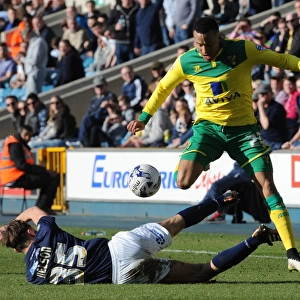 Millwall vs Norwich City: Sid Nelson Tackles Martin Olsson in Sky Bet Championship Action at The Den