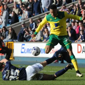 Millwall vs Norwich City: Sid Nelson Tackles Martin Olsson in Sky Bet Championship Action at The Den Millwall vs Norwich City: Sid Nelson Tackles Martin Olsson in Sky Bet Championship Action at The Den