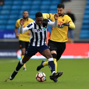 Millwall vs Watford in Emirates FA Cup: Onyedinma and Britos Clash for Ball at The Den Millwall vs Watford in Emirates FA Cup: Onyedinma and Britos Clash for Ball at The Den