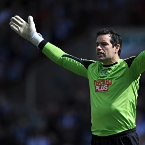 Millwall's David Forde Saves Huddersfield Town's Penalty in Championship Clash at John Smith's Stadium (20-04-2013)