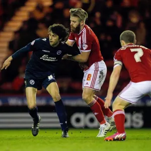 Millwall's Diego Fabbrini Fends Off Middlesbrough's Adam Clayton in Sky Bet Championship Clash at Riverside Stadium