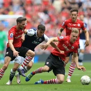 Millwall's Lee Gregory Faces Off Against Barnsley's Conor Hourihane and Marc Roberts in Sky Bet League One Play-Off Final at Wembley Stadium Millwall's Lee Gregory Faces Off Against Barnsley's Conor Hourihane and Marc Roberts in Sky Bet League One Play-Off Final at Wembley Stadium