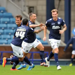 Millwall's Scott McDonald Scores First Goal: Celebrating with Team Mates in Sky Bet Championship Match against Blackpool at The Den Millwall's Scott McDonald Scores First Goal: Celebrating with Team Mates in Sky Bet Championship Match against Blackpool at The Den