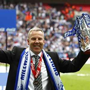 Millwall's Triumph: Kenny Jackett and The Lions Celebrate Promotion to League One with the Play-Off Trophy at Wembley