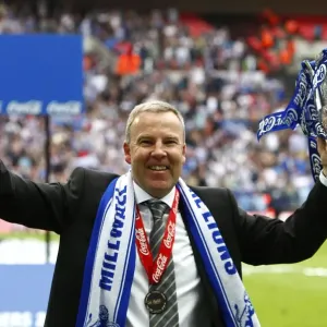 Millwall's Triumph: Kenny Jackett and The Lions Celebrate Promotion to League One with the Play-Off Trophy at Wembley