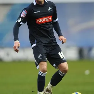 Scott Barron's Unwavering Determination: Millwall vs Bolton Wanderers in FA Cup Fifth Round at The Den Scott Barron's Unwavering Determination: Millwall vs Bolton Wanderers in FA Cup Fifth Round at The Den