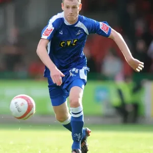 Swindon Town vs Millwall in Football League One: Intense Moment at County Ground with Marc Laird, Millwall