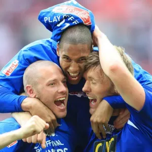 The Triumphant Threesome: Millwall's Alexander, Batt, and Ward Celebrate Promotion at Wembley