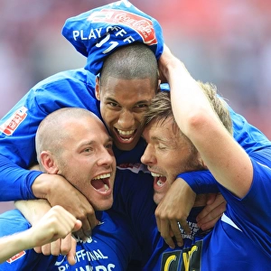 The Triumphant Threesome: Millwall's Alexander, Batt, and Ward Celebrate Promotion at Wembley