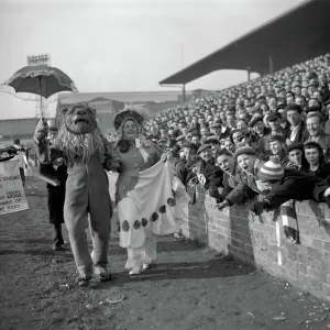 Vintage FA Cup Print: Millwall Lion vs. Birmingham Lady at The Den Vintage FA Cup Print: Millwall Lion vs. Birmingham Lady at The Den