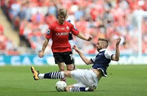 Images Dated 29th May 2016: Barnsley's Lloyd Isgrove and Millwall's Mark Beevers Clash in League One Play-Off Final at Wembley
