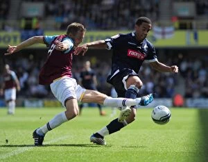 Images Dated 17th September 2011: Battle for the Ball: Feeney vs. Taylor - Millwall vs. West Ham United in the Npower Championship