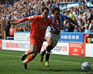 Images Dated 20th April 2013: Battle for the Ball: Huddersfield Town vs. Millwall - Npower Championship Rivalry