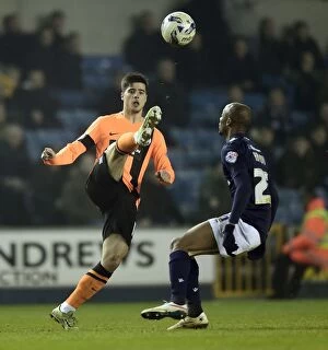 Images Dated 17th March 2015: Battle for Supremacy: Abdou vs. Teixeira in Millwall vs. Brighton Championship Clash