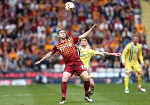 Sky Bet League One - Bradford City v Millwall - Play Off - First Leg - Coral Windows Stadium Collection: Battle for Supremacy: Davies vs. Thompson in the Millwall vs