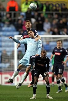Images Dated 17th April 2012: Clash at Ricoh Arena: Coventry's McDonald vs Millwall's Ward in Championship Showdown