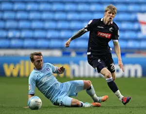 Clash at Ricoh Arena: Sammy Clingan Tackles Andy Keogh in Millwall vs. Coventry City Championship Showdown