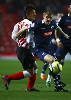 Season 2011-12 Prints: FA Cup: Southampton vs Millwall - Tadanari Lee vs Tony Craig