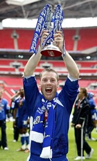 The Glory of Millwall: Neil Harris's Triumphant Moment with the Football League One Play-Off Trophy at Wembley Stadium