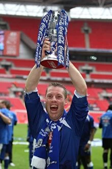 The Glory of Millwall: Neil Harris's Triumphant Moment with the League One Play-Off Trophy at Wembley