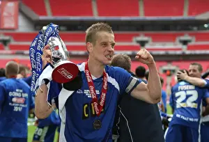 The Glory of Millwall: Paul Robinson's Triumphant Trophy Lift after Winning the Play-Off Final at Wembley Stadium against Swindon Town (Coca-Cola Football League One)