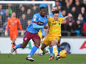Hakeeb Adelakun vs Millwall: Intense Battle for Possession at Scunthorpe United's Glanford Park