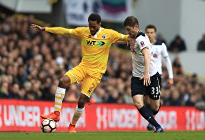 Intense Rivalry: Davies vs. Cummings in the Emirates FA Cup Quarterfinal at White Hart Lane