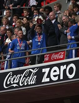 Millwall FC's John Sullivan Lifts the Promotion Trophy at Wembley Stadium