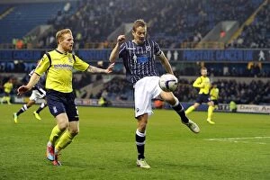Images Dated 25th March 2014: Millwall vs Birmingham City: Robinson Clears the Threat at The Den (Sky Bet Championship)