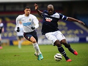 Millwall vs. Blackburn Rovers: FA Cup Quarterfinal Showdown - A Battle for the Ball between Danny Shittu and Leon Best (The Den, 10-03-2013)
