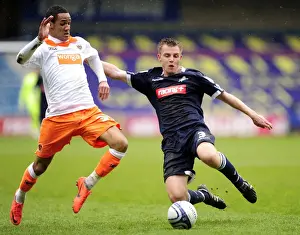 Millwall vs Blackpool: Intense Battle Between Tony Craig and Thomas Ince in Championship Showdown (28-04-2012)